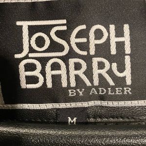 This is a very sharp brand new leather jacket with a hood